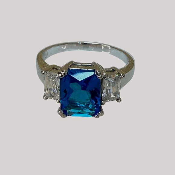 Silver Tone Cocktail Ring With Blue Emerald-Cut Center & Clear Side Size 10 - Picture 2 of 16